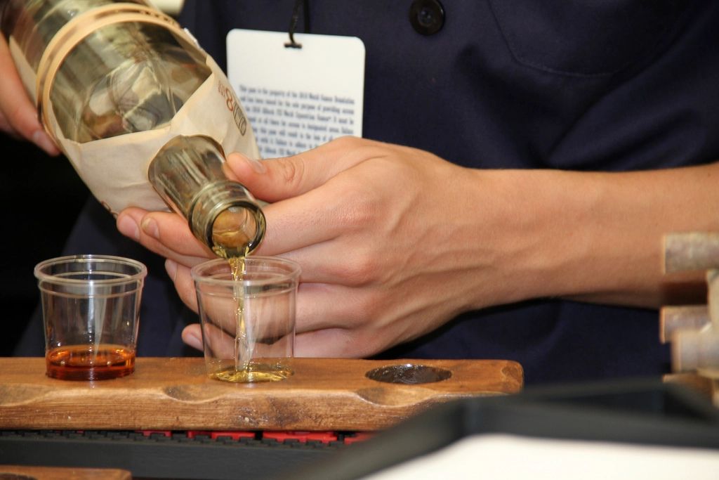 A cocktail being finished at the bar